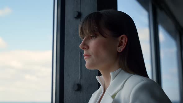 Thoughtful Businesswoman Looking Window Closeup