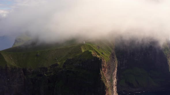 Drone Of Kallur Lighthouse On Cliff Edge On Kalsoy Island