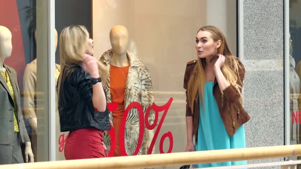 Two Blondes on Shopping Discuss Something Very Emotional About Windows