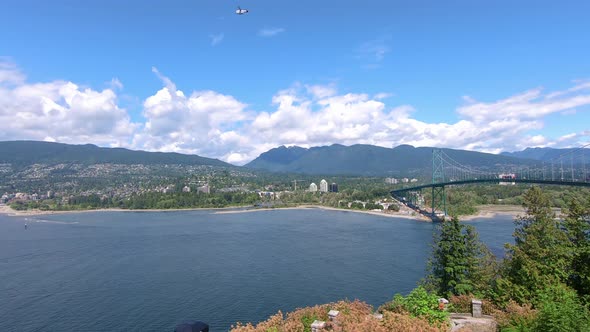 Panoramic view of Lions Gate Bridge from Stanley Park in Vancouver, BC Canada; a suspension bridge t