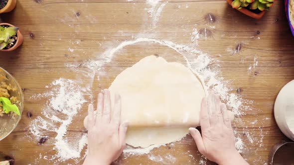 Flat lay. Step by step. Rolling dough for home made empanadas.