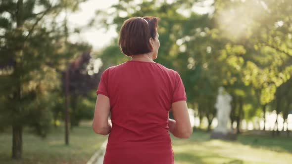 Woman Running at the Sunset