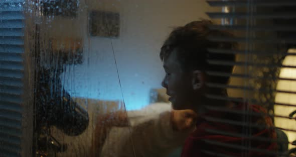 Boy Watching Storm with Grandfather