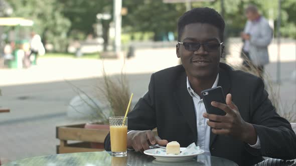 Happy African-american Businessman Taking Selfie in Cafe