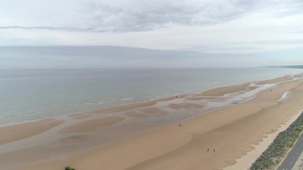 Spectacular aerial drone view of Omaha Beach landing area in Colleville sur Mer, Normandy, France
