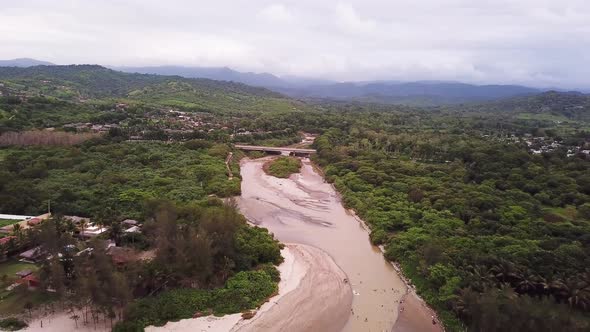 The Sky View Of Olon Beach In Santa Elena Ecuador Surrounded By The Lush Green Trees During Daytime