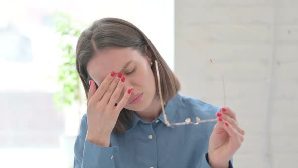 Portrait of Young Woman having Headache