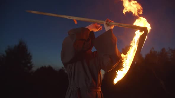 Eerie Death Reaper Frightening with Burning Scythe