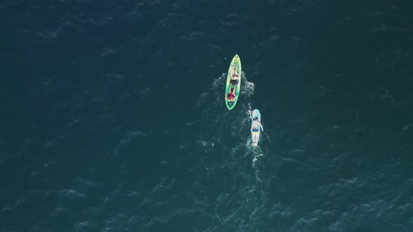 Aerial People in Colorful Kayak and Surfer on Paddle Board in Blue Ocean