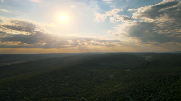 HDR  Aerial View the Drone's Flight Over the Rainforest with a Formidable Sunset