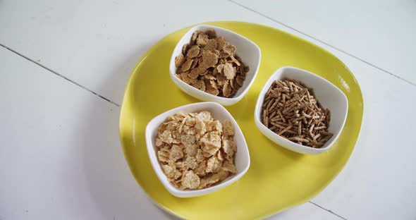 Wheat flakes and cereal bran sticks in bowl 4k