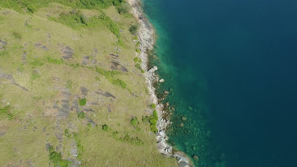 Aerial view of seashore in phuket island.Beautiful sea surface Amazing waves seascape mountain view