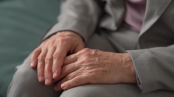 Hands in the Wrinkles of an Elderly Man