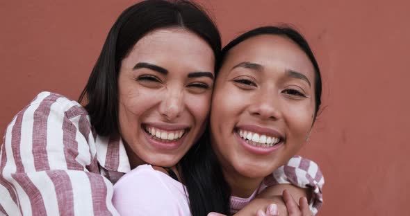 Happy young latin women taking selfie - Concept of friendship and happiness