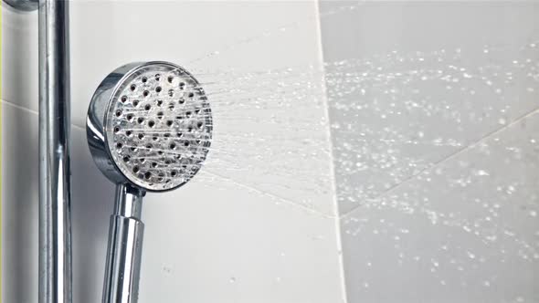 Splashes of Water Pour From the Shower Head