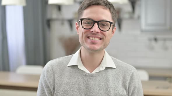 Smiling Young Man Looking at the Camera