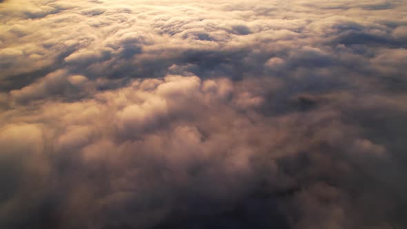 4K Sun is rising above sea of clouds until the horizon