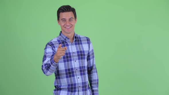 Happy Young Handsome Hipster Man Pointing To Camera