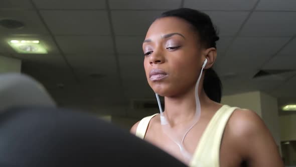 Female running on treadmills, cardio workout exercise in gym