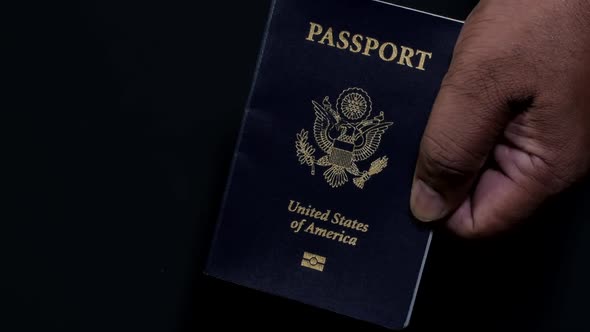 Hand Holds American Passport 