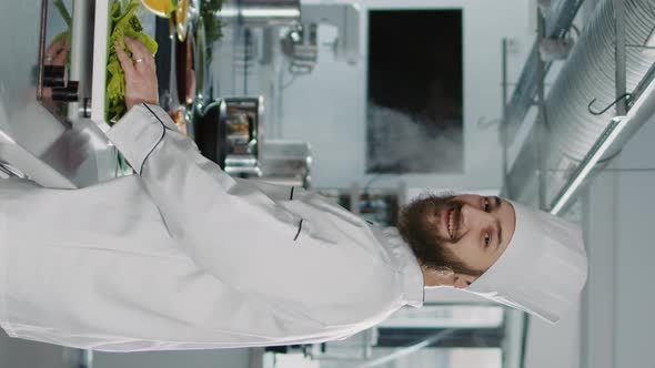 Vertical Video Portrait of Man Working As Cook in Gourmet Kitchen at Restaurant