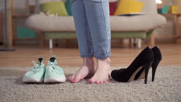 Woman Chooses Highheeled Shoes Instead of Sneakers