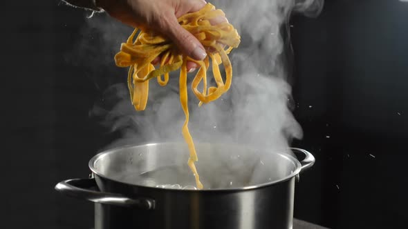 Putting Raw Pasta Into Boiling Water