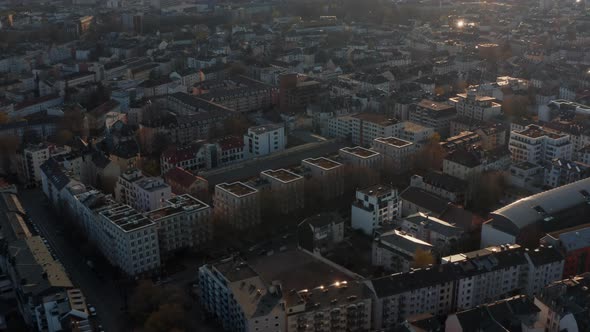Aerial View From Drone Flying Above Urban Neighbourhood in Golden Hour