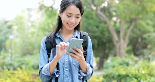 Woman use of cellphone in the city 