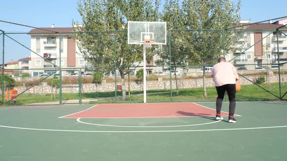 Dribble Basketball on Court