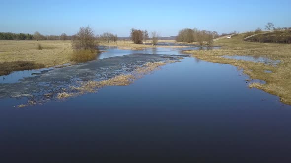 Flight Over the Swampy Terrain in the Spring