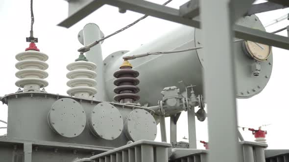 Air High-voltage Switches. Electrical Poles with Wires and Insulators at the Electrical Substation