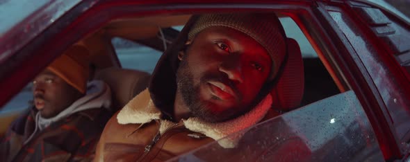 African American Man Talking with Friend in Car