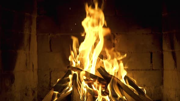 Burning Fire In The Fireplace. Slow motion. A looping clip of a fireplace with medium size flames