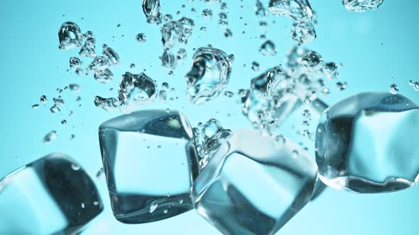 Super Slow Motion Shot of Clear Ice Cubes Falling Into Water at 1000Fps alt