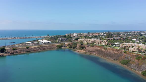 Aerial view of the coastal city Carlsbad and beachfront houses looking over the sea