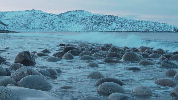 Snowcapped Mountains Surround the Bay and the Waves Roll on the Beach Dragon Eggs