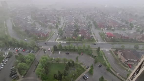 Toronto neighborhood under heavy rainstorm. Aerial high angle view. cityscape