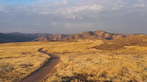 Two Hikers Hiking on a Trail in North Table Mountain Park