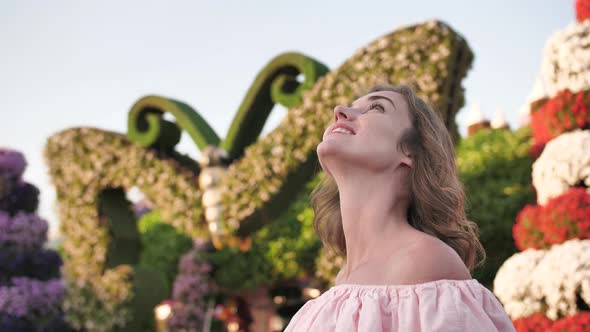 A Girl Walks Through a Beautiful Fairytale Park in Dubai