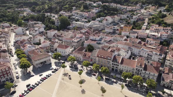 Aerial pull out shot overlooking at the cityscape in front of Alcobaça monastery, Portugal.