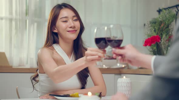 Asian young couple having dinner to celebrate valentine's day together.