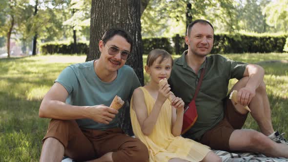 Family Relaxing In Park