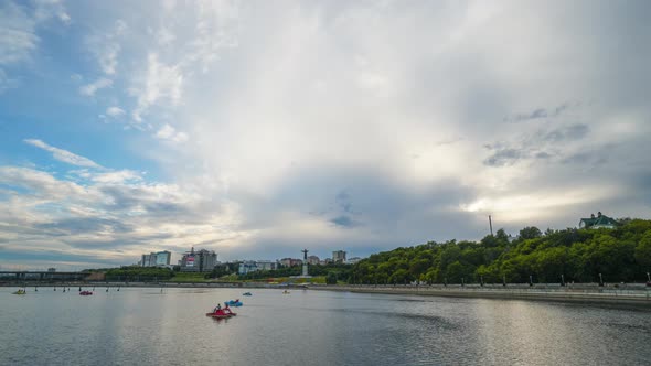 People in a Pond Boating