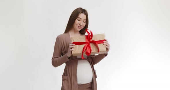 Happy Young Pregnant Woman Holding Gift Box Enjoying Holiday Celebration Presents