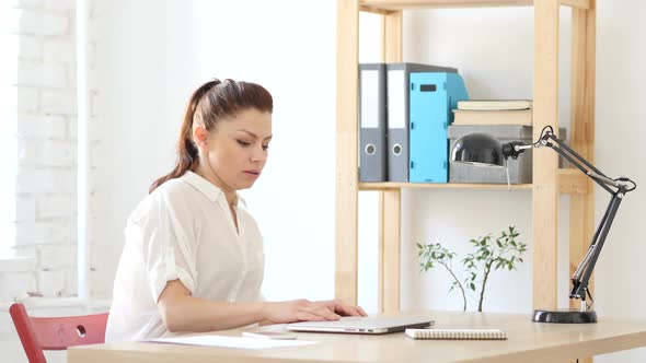 Woman Coming to Work, Starts Work on Laptop