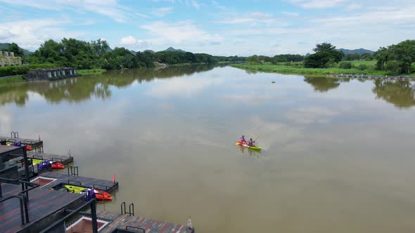 Couple Men and Women in Kayak on the River Kwai in Thailand