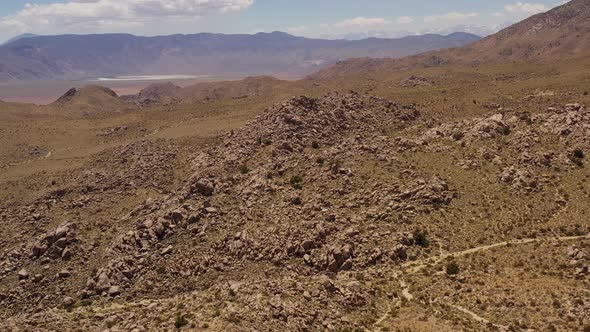 Aerial shot of interesting rock formations in the desert of California