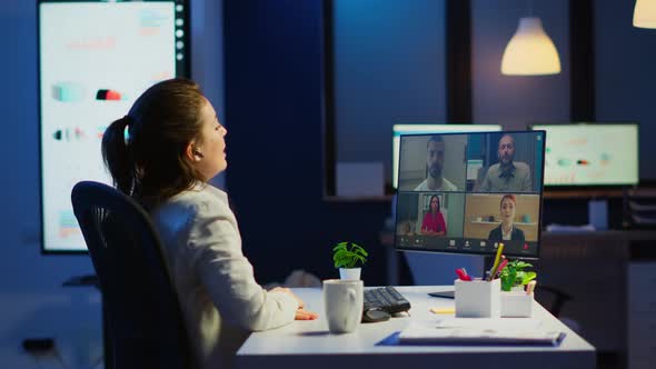 Businesswoman Talking During Video Conference with Team in Midnight