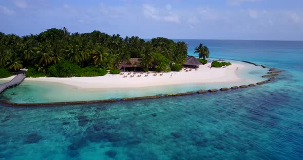 Wide drone abstract view of a white sand paradise beach and blue sea background in colourful 4K